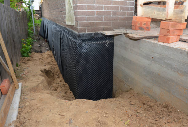 SJ Waterproofing Pros technician performing targeted Waterproofing assessment in New Lothrop, MI